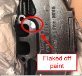 Barr Manifold with paint flaking off.png
