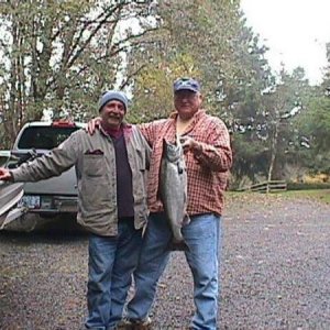 This is my fishin' partner Paul and all around good guy, go for, holder oner, what can I do to help dude.  He's the one holding the little Chinook.  I