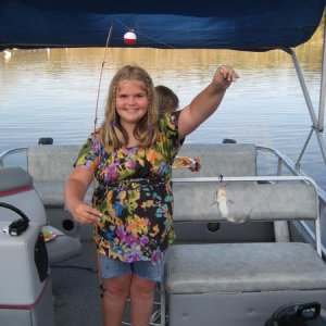 my daughter holding a small channel cat (big hollow lake 2010)