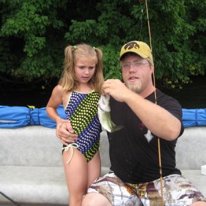 me and my daughter, she cuaght that bass on a worm.. once it was in the boat, she wasnt sure what she thought of it, geode lake july 2010