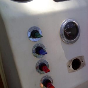 Re-wired entire boat. Installed custom lighted switches and used original switch label plates.