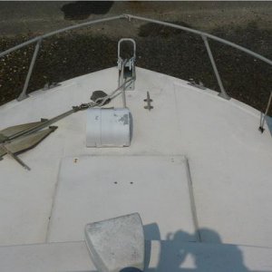 Fore deck. Working anchor winch and search light. Deck hardware appears to be solid