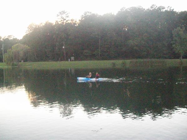 Beautiful view looking out from back deck of boat. watching Kadry and Haley Kayak.