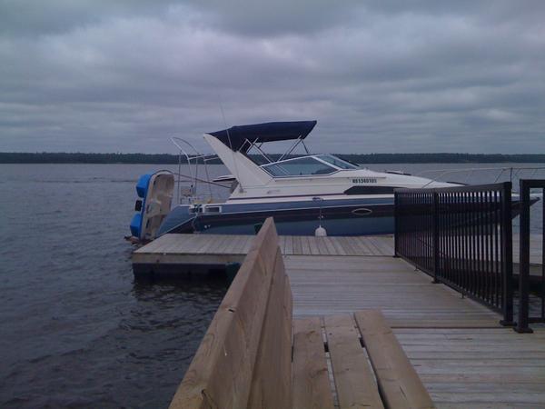 Built a peddle boat lift that can raise and lower the peddle boat into the water by using the stern drive. Made two rods and installed cleats on the p