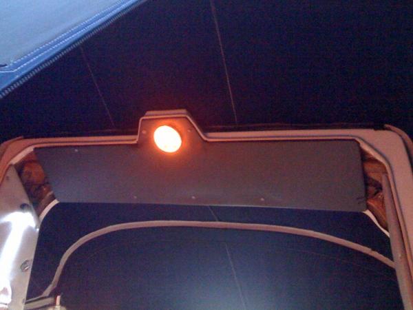 Cut a new panel & covered with grey vinyl then installed a super bright yellow LED dome light.