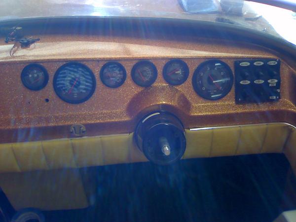 Gauges installed on dash.  When I got the boat, it had a surface mount speedo, located right about where that hole is. Nothing more.  My gauge placeme