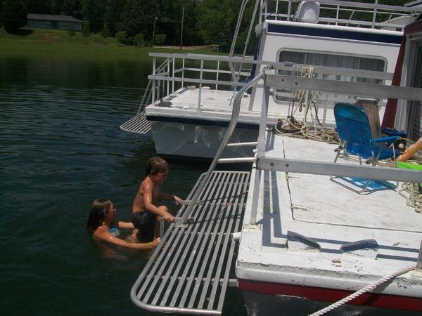 Kadry and friends jumping into the water from the back of the houseboat. Fun weekend!