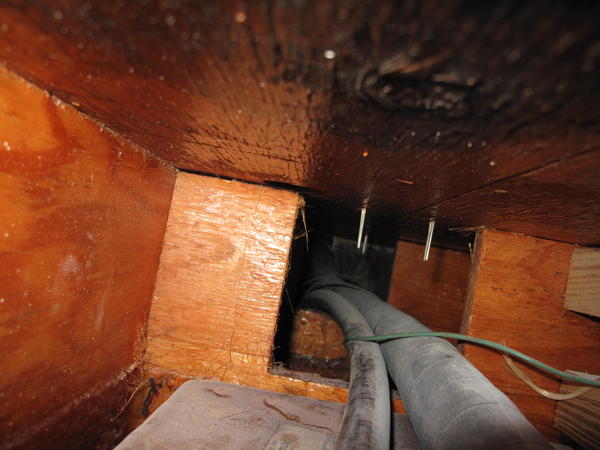 looking (right) along gas lines under floor