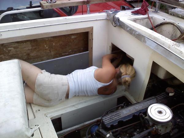 My wife installing the new bilge system. At least when I get frustrated and have to take a break, I have this to look at..;)