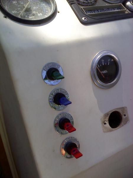 Re-wired entire boat. Installed custom lighted switches and used original switch label plates.