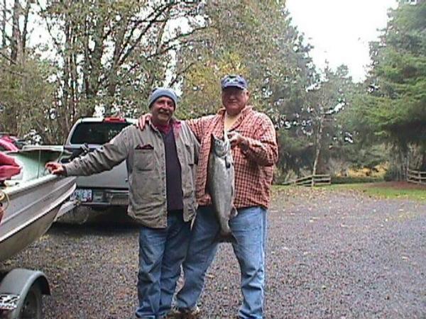 This is my fishin' partner Paul and all around good guy, go for, holder oner, what can I do to help dude.  He's the one holding the little Chinook.  I