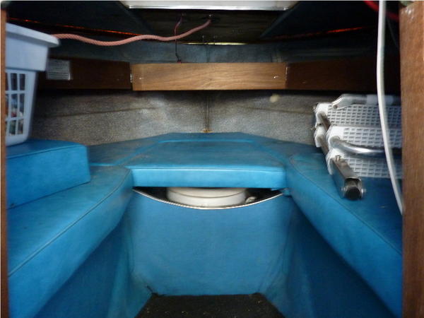 V berth with working head and a laundry basket as an anchor locker.