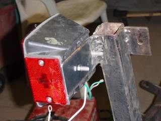 welded on additional "ears" to side guide supports for high mounted lights